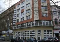 Wohn und Geschäftshaus mit fünf Wohnungen und drei Gewerbeeinheiten im Mülheim-Mitte-der Stadt am Fluss